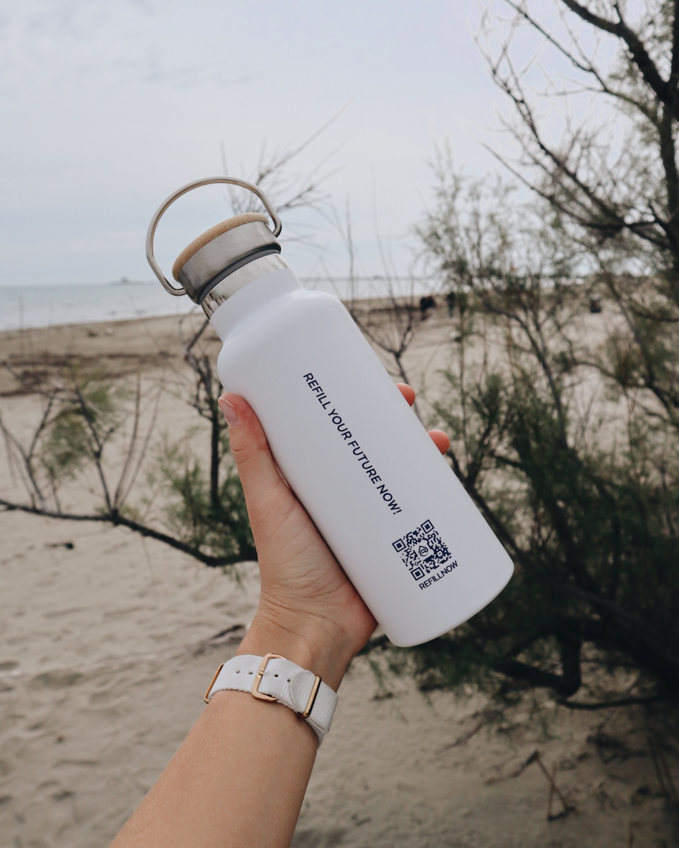 qr code for clean drinking water on the back of a water bottle on the beach