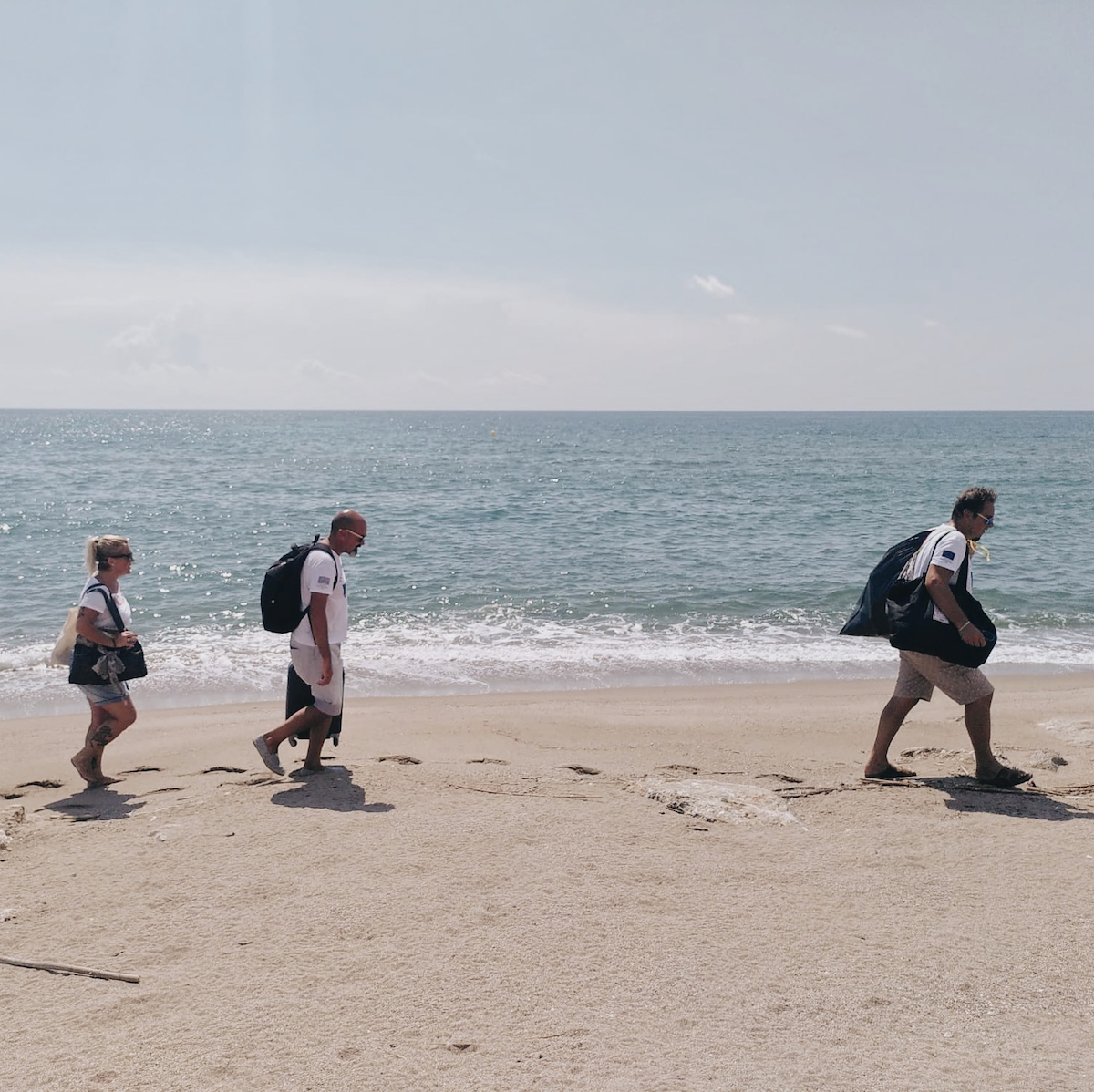 vlpf carrying out marine litter monitoring on the beach in barcelona